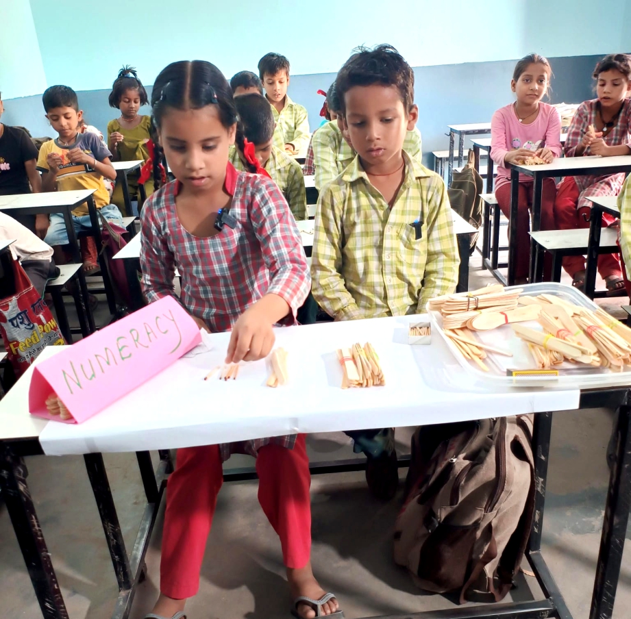 Children engaged in foundational literacy activity